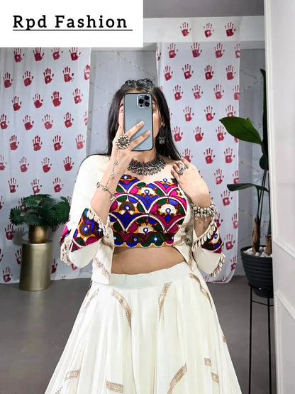 A woman in a flowing white cstands against a wall, emphasizing her elegant style and the dress's design - RPD Fashion