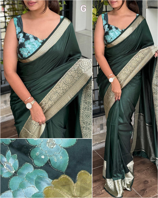 Green saree with floral patterns and gold border, worn by a person indoors.